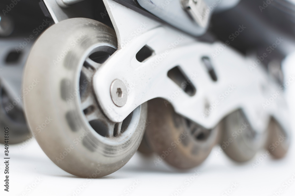 closeup to the wheels of used roller skates. closeup to the wheels of used roller skates.