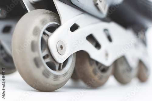 closeup to the wheels of used roller skates.