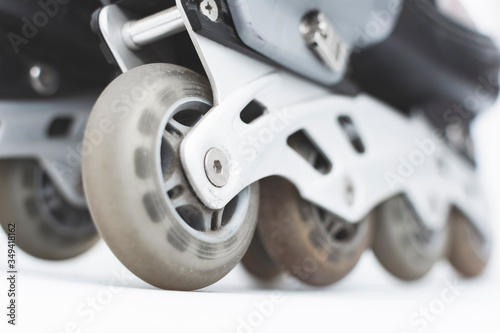 closeup to the wheels of used roller skates.