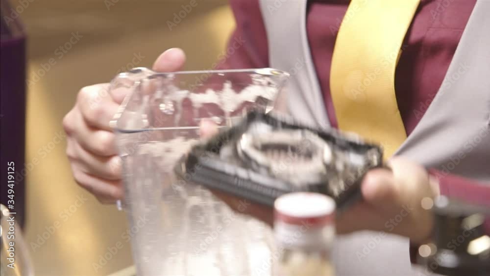 Man pouring the drink into the glass - pan follow Man pouring the drink into the glass - pan follow