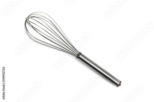 Close up egg beater over white background from top view.