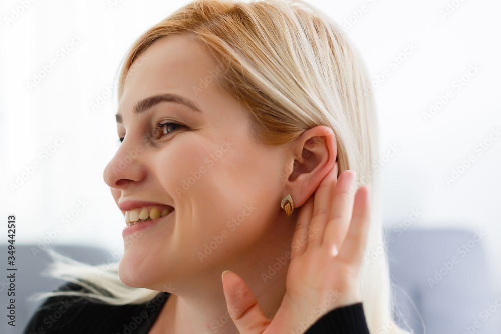 Portrait of woman overhearing a conversation Portrait of woman overhearing a conversation