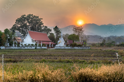 Northern Thailand During the Burning Season causes a beautiful sunset photo