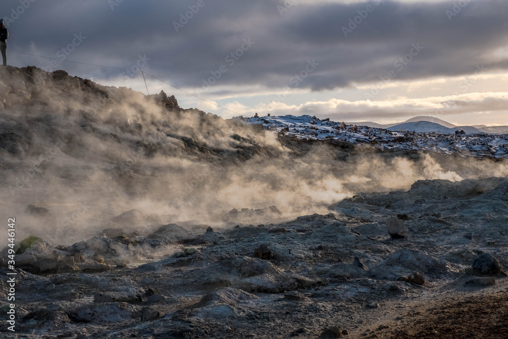 Clouds of water vapor smelling sulfur sprouts in the Hverir volcanic area, Iceland