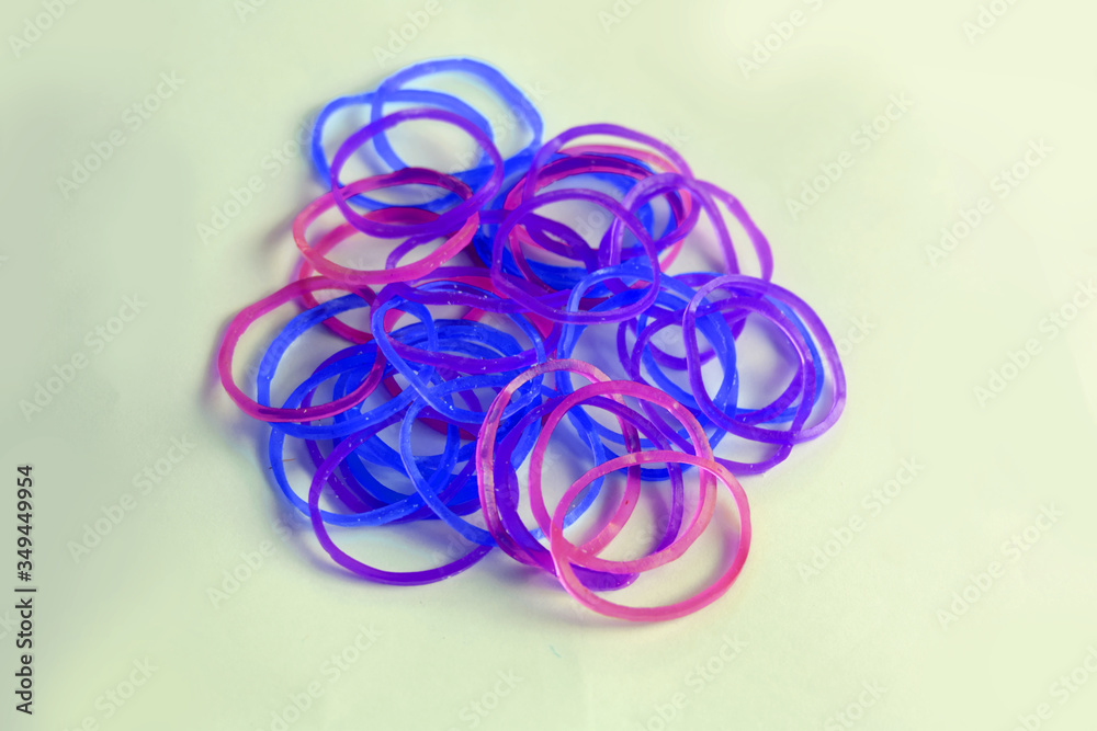 Multi coloured hair accessories,Rubber band on white background Multi coloured hair accessories,Rubber band on white background