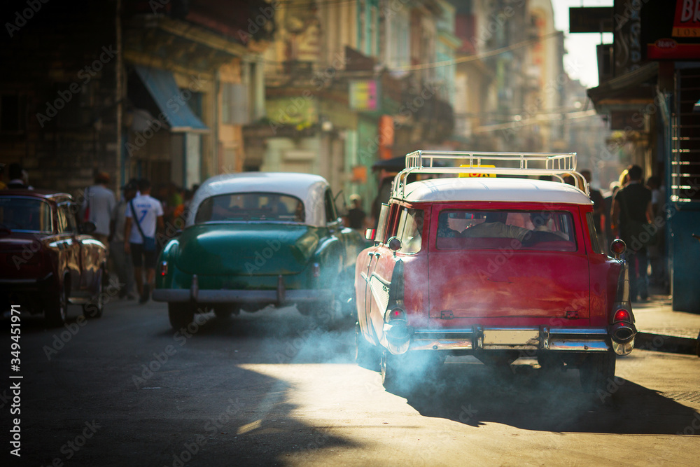 HAVANA - FEBRUARY 25: Classic car and antique buildings on February 25, 2015 in Havana. These vintage cars are an iconic sight of the island HAVANA - FEBRUARY 25: Classic car and antique buildings on February 25, 2015 in Havana. These vintage cars are an iconic sight of the island