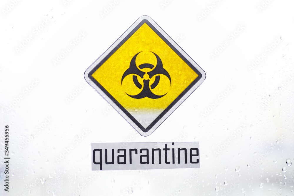 Fototapeta premium Quarantine. Quarantine warning sign on a glass door in a hospital isolator. Isolation of patients with the virus in special laboratories. Virus.