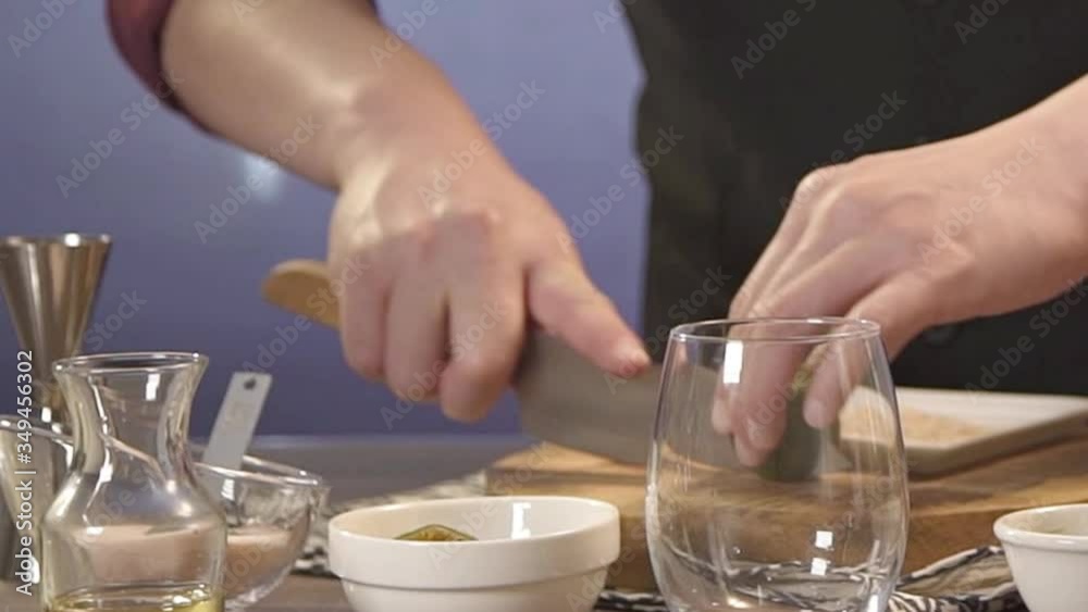 cutting lime with a kinfe behind glass - panning cutting lime with a kinfe behind glass - panning