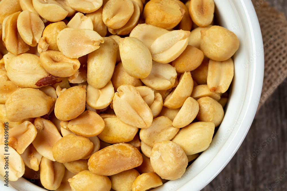 A top down view of a bowl of peanuts. A top down view of a bowl of peanuts.