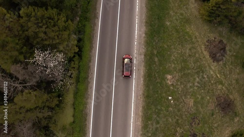  the car goes on a mountain road, shooting from a height
