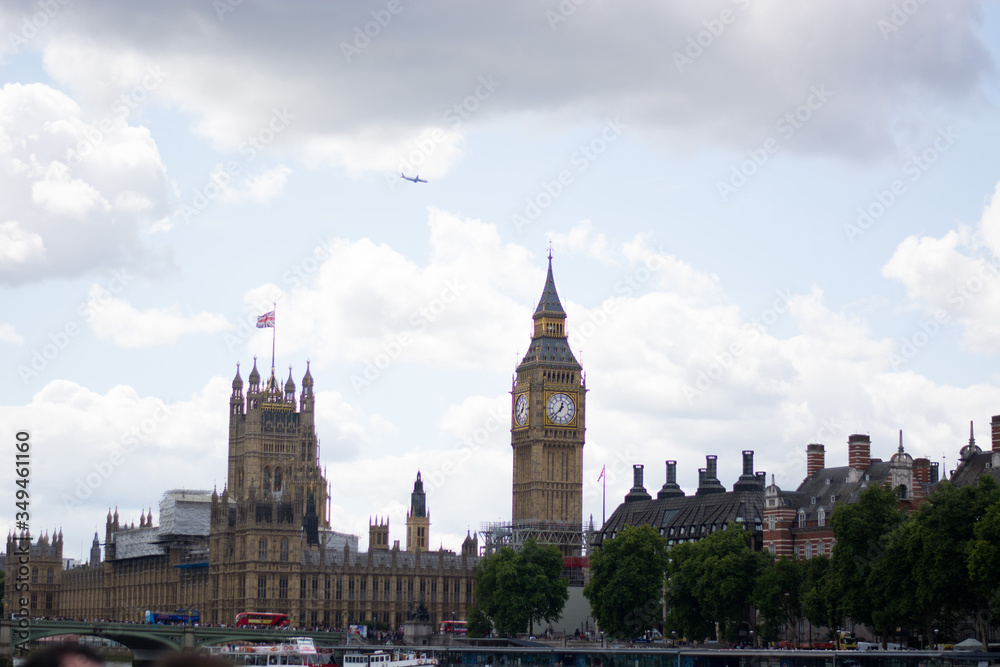 Photo of big ben clock tower and palace of westminster in London. Tourist attraction photo, cloudy and rainy weather