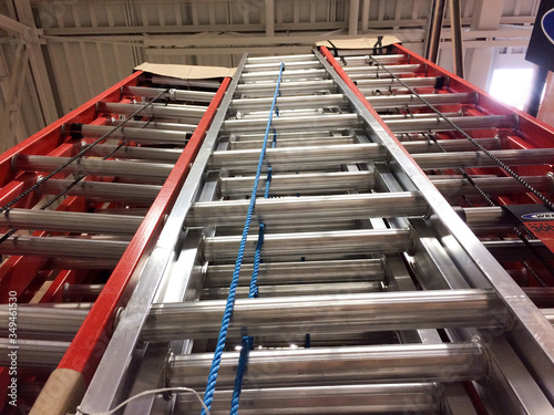 Metal fiberglass ladders at home improvement warehouse store climbing high concept