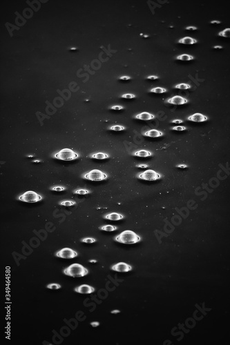 white bubbles in black water