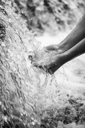 water flowing into the hand