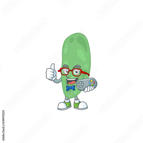 Cartoon mascot design of thermus thermophilus play a game with controller