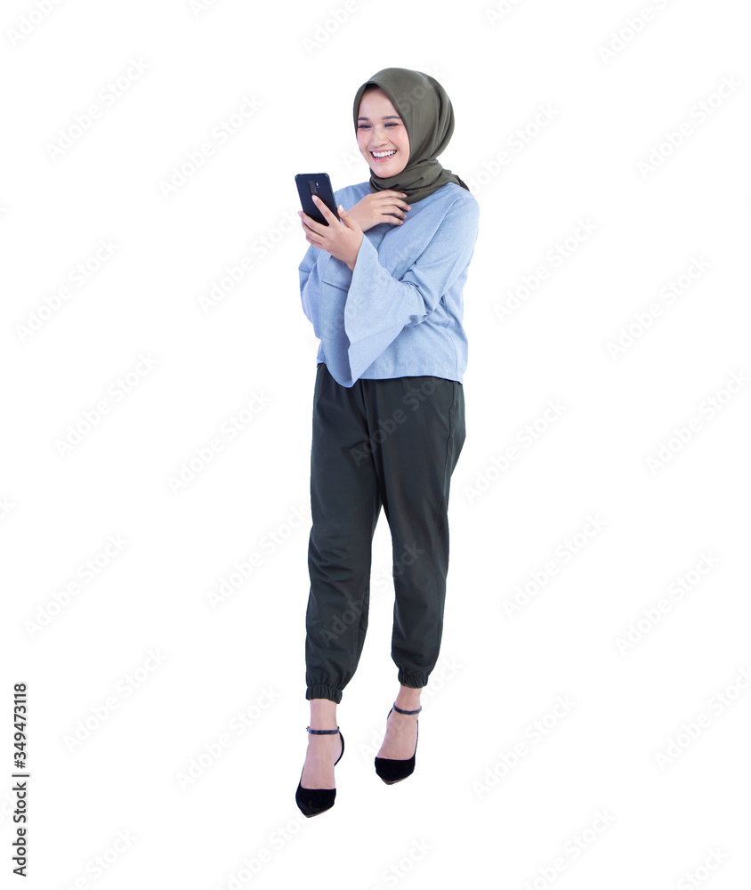 Beautiful hijab woman making a video call with a smile expression. Isolated on white background Beautiful hijab woman making a video call with a smile expression. Isolated on white background