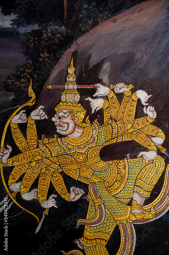 Gold color of old mural is the story of Ramakian,Generally in Thailand, any kinds of art decorated in Buddhist church, temple pavilion, temple hall, monk's house etc. created with money donated by peo photo