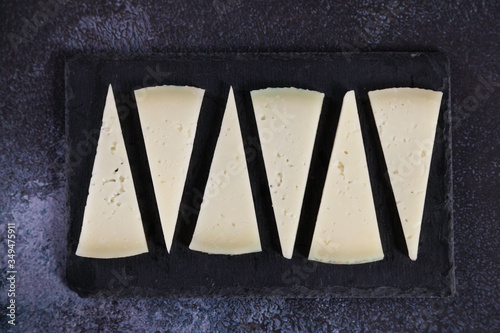 six slices of typical spanish manchego cheese photo
