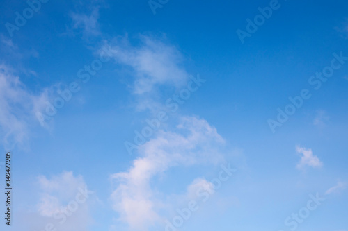 light beautiful clouds on blue sky. Soft background and texture