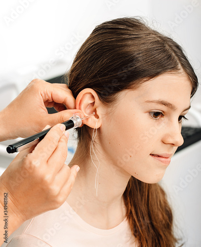 Process of making earplugs from an impression of an individual s child ear. Ear close-up. Personally molded earplugs. Part of the set