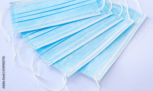 close-up of blue facemasks on white background