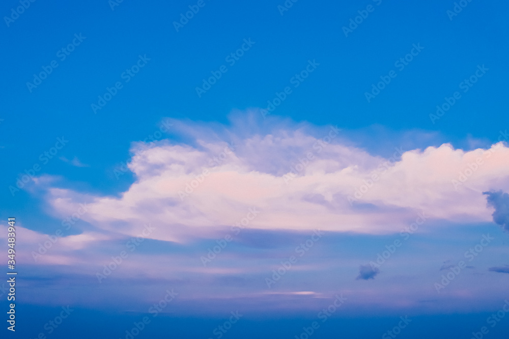 Bright picturesque sky of blue color with light clouds. Background