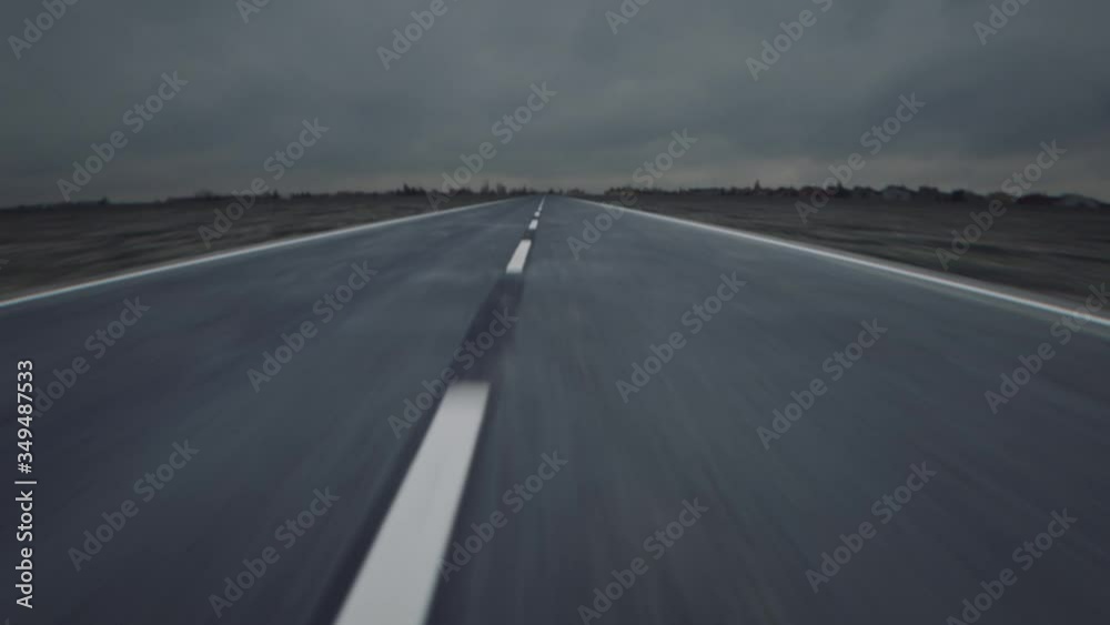 Driving very fast on endless looping road. 3D animation loop. Cinematic color grading. POV. 