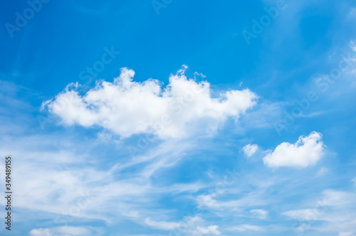 Fluffy white cloud in the blue sky.