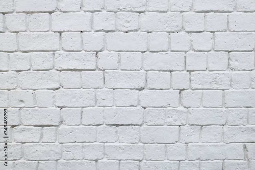 Old brick wall painted in white color Old brick wall painted in white color
