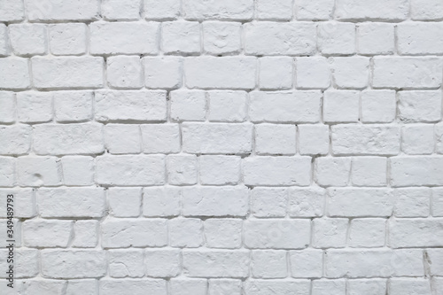 Old brick wall painted in white color