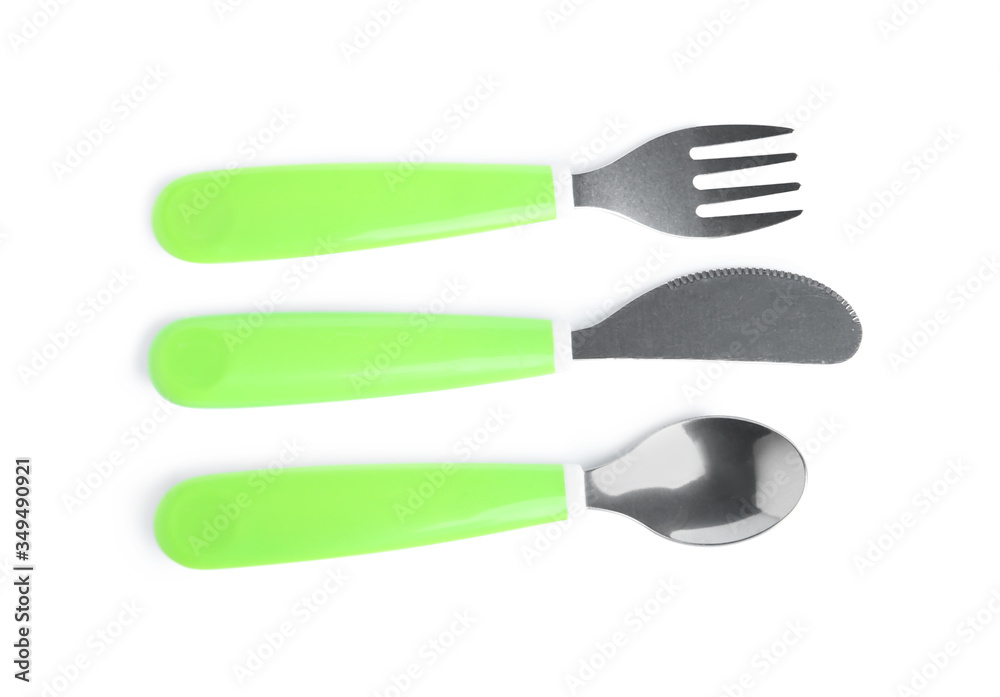 Cutlery with plastic handles isolated on white, top view. Serving baby food Cutlery with plastic handles isolated on white, top view. Serving baby food