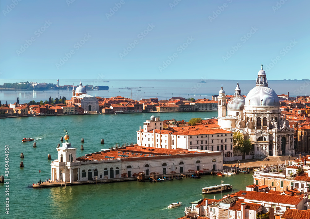 Panoramic top view on Venice, the Basilica Santa Maria della Salute and San Giorgio Maggiore cathedral from the bell tower of St. Mark's Cathedral, Italy