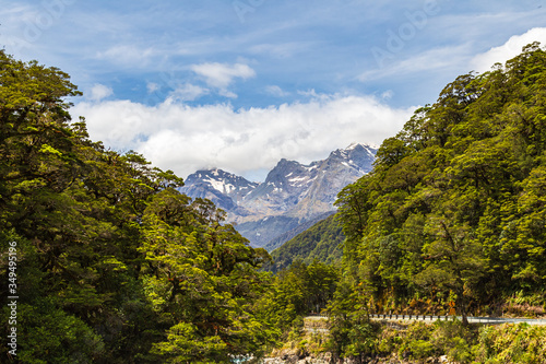 Landscape with road, river and snow-capped mountains. Fjordland national park, New Zealand