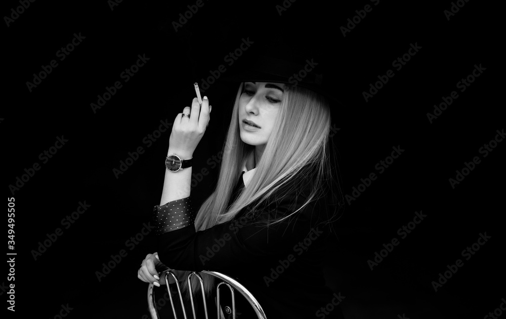 Φωτογραφία Elegant woman smoking, cinema style, artistic commercial photo for some campaign