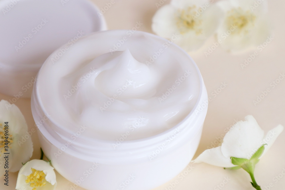 Cream moisturizer in the white jar. The concept of health and beauty.