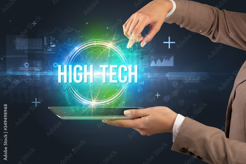 Close-up of a touchscreen with HIGH-TECH inscription, new technology concept Close-up of a touchscreen with HIGH-TECH inscription, new technology concept