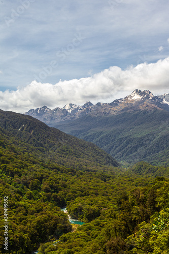 View of the mountains, dense forest and the river below. Landscapes of Fiordland National Park. South Island, New Zealand
