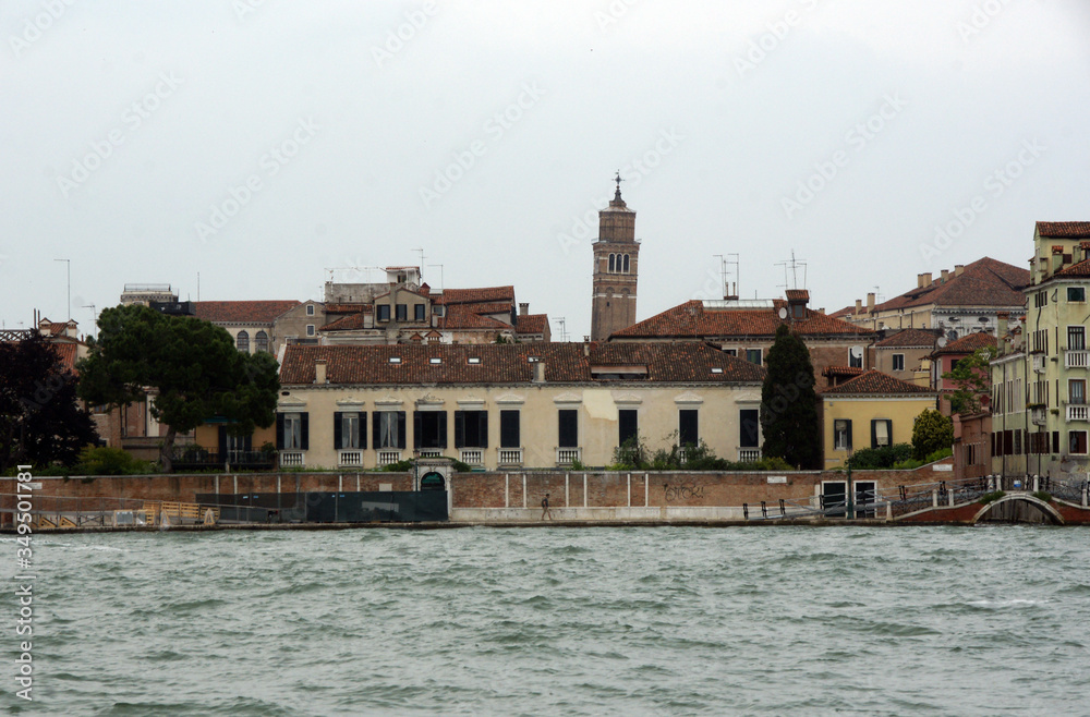 Cityscape with historical facades and companile in Venice. View from the adriatic sea