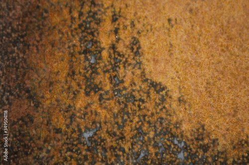 Orange red iron in rust.