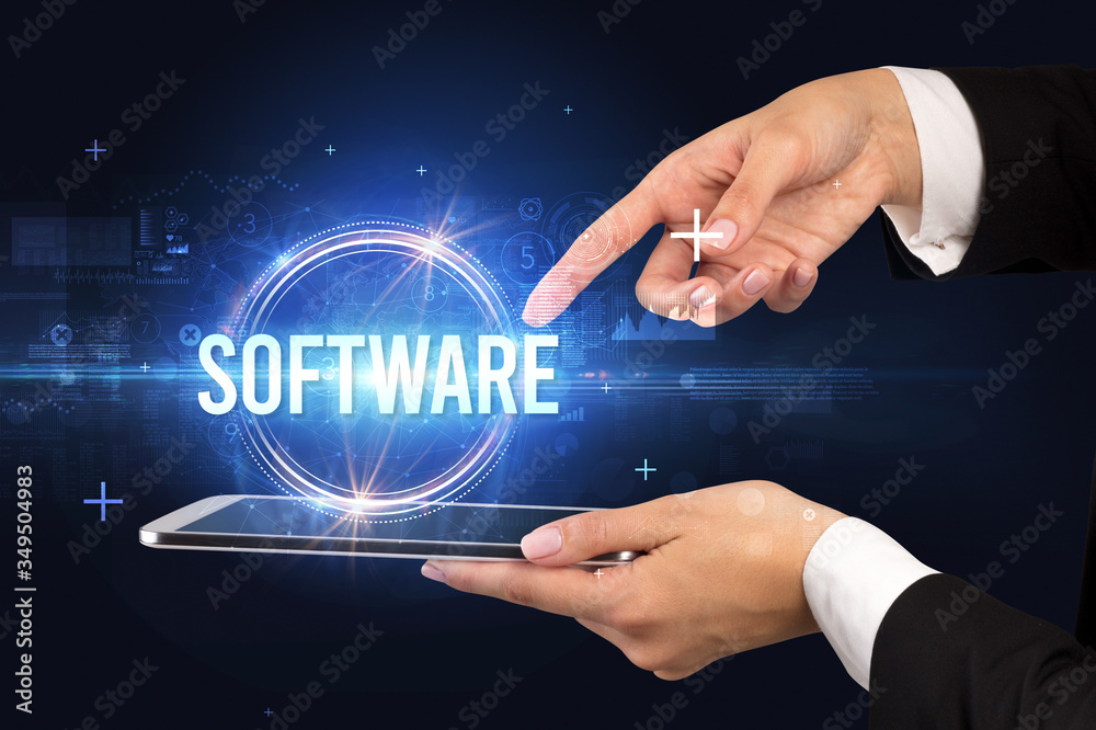 Close-up of a touchscreen with SOFTWARE inscription, new technology concept Close-up of a touchscreen with SOFTWARE inscription, new technology concept