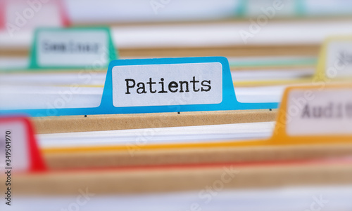 File folders with a tab labeled Patients