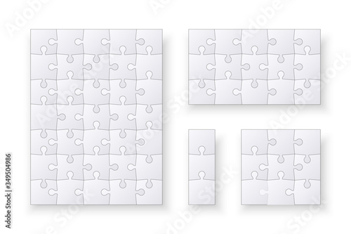 Set of jigsaw puzzle templates. Many puzzle pieces isolated on a white background. Vector illustration