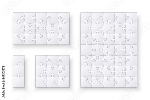 Set of jigsaw puzzle templates. Many puzzle pieces isolated on a white background. Vector illustration