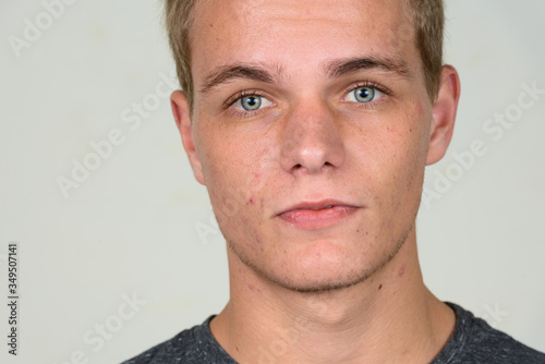Face of young handsome man with blond hair