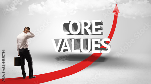 Rear view of a businessman standing in front of CORE VALUES inscription, successful business concept © ra2 studio