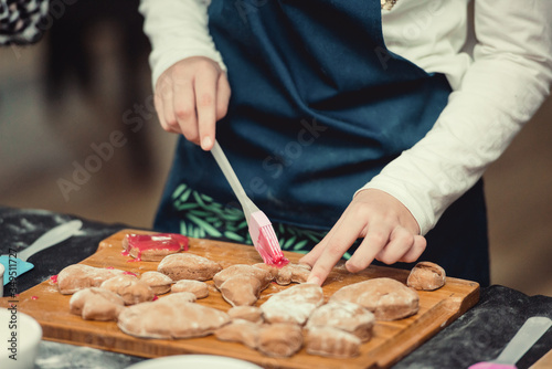 Close up of cookies baking. Little kids hands