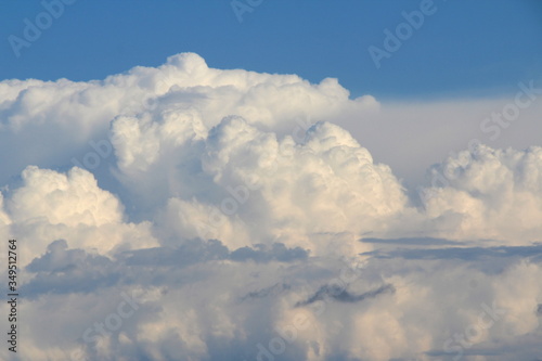 Cloudy blue sky with white and gray clouds. Background for text and design.