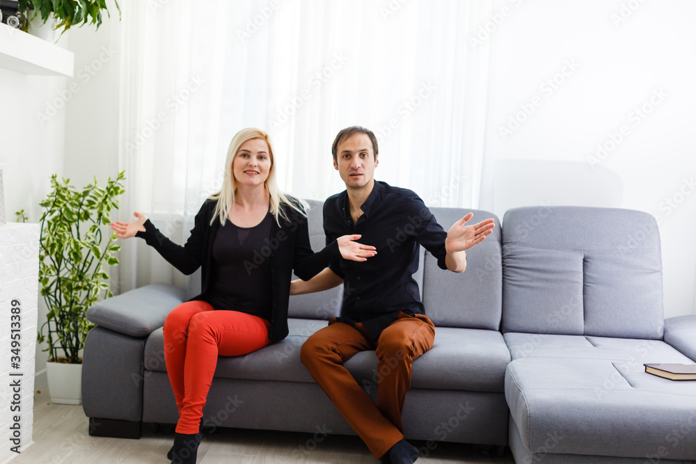 Happy young couple is hugging and smiling while sitting on the couch at the psychotherapist. Happy young couple is hugging and smiling while sitting on the couch at the psychotherapist.