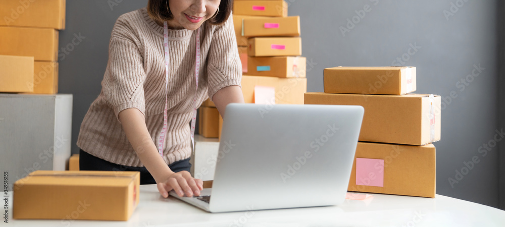 Startup small business owner working with computer at workplace. Freelance woman seller check product order. Packing goods for delivery to customer. Online selling. E-commerce. Online Shopping
Startup small business owner working with computer at workplace. Freelance woman seller check product order. Packing goods for delivery to customer. Online selling. E-commerce. Online Shopping