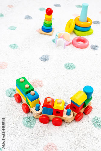 Wallpaper Mural Top view on Colorful Baby Toys on a Carpet Background Toys in the floor with Copy Space for Text Torontodigital.ca